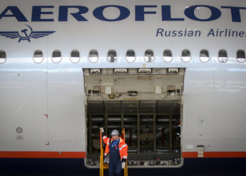 An employee inspects the cargo hold of a Boeing-777 aircraft, during the opening of the A-Technics engineering center at Moscow-Sheremetyevo Airport. (Photo by Leonid Faerberg / SOPA Images/Sipa USA)