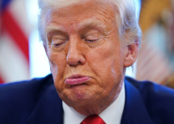 U.S. President Donald Trump reacts, as he signs executive orders and proclamations, in the Oval Office at the White House in Washington, D.C., U.S., April 9, 2025. REUTERS/Nathan Howard