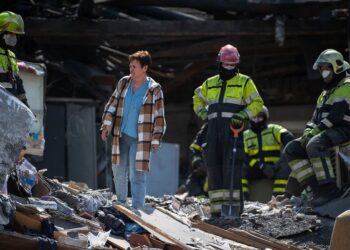Rescue workers search through the rubble of a bombed building in Kyiv, Ukraine. (Photo Human Rights Monitoring Mission in Ukraine/Anastasiia Honcharuk