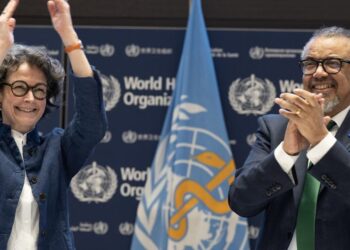 WHO Director-General Tedros Adhanom Ghebreyesus (right) and INB Co-Chair Anne-Claire Amprou of France (left) celebrate at the conclusion of negotiations in the early hours of 16 April 2025. (WHO/Christopher Black)