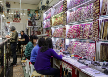 Employees work at Popular Jewelry in Chinatown in New York City, U.S., April 16, 2025. REUTERS/Kylie Cooper