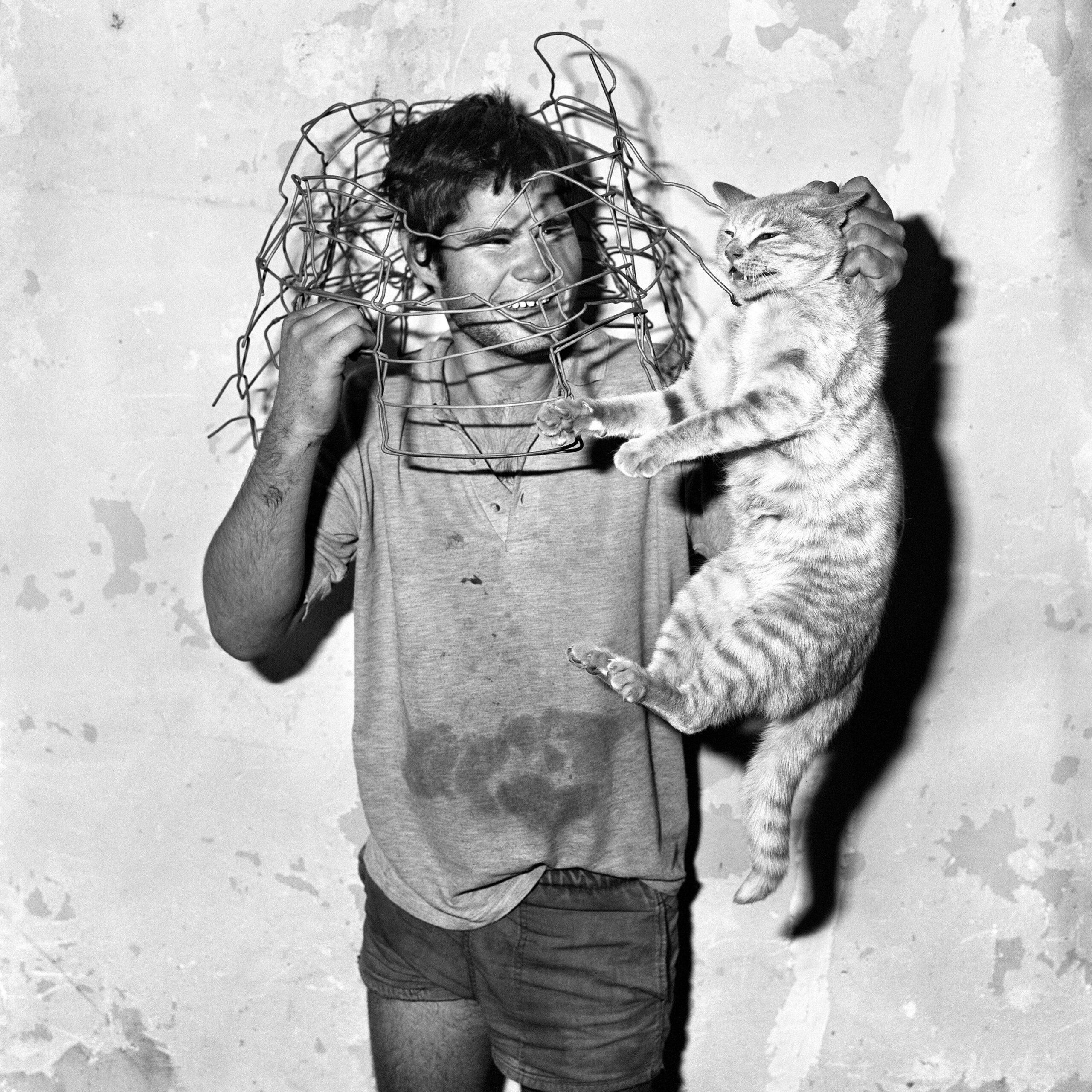 Roger Ballen, Cat Catcher, 1998. Courtesy the artist.In mostra: Animalism, Mattatoio di Roma, Padiglione 9A.