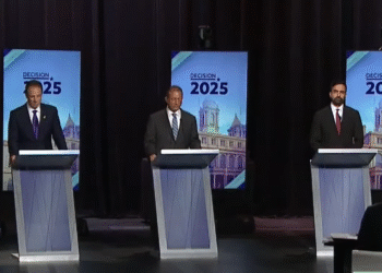 (Left to right) Andrew Cuomo, Brad Lander, and Zohran Mamdani on stage at the Gerald W. Lynch Theater at John Jay College (YouTube screenshot: @spectrumlocalnews)