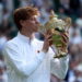 Jannik Sinner of Italy celebrates with the trophy after winning the Men's Singles final match against Carlos Alcaraz of Spain at the Wimbledon Championships, Wimbledon, Britain, 13 July 2025.  EPA/NEIL HALL