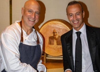Nicola Bertinelli and Chef Tom Colicchio with a custom wheel of Parmigiano Reggiano at his NYC restaurant Vallata, June 30, 2025 -