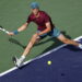 epa10531149 Jannik Sinner of Italy in action against Carlos Alcaraz of Spain during the men's semifinal round of the BNP Paribas Open tennis tournament at the Indian Wells Tennis Garden in Indian Wells, California, USA, 18 March 2023.  EPA/JOHN G. MABANGLO
