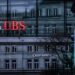 The logos of the Swiss banks Credit Suisse and UBS are displayed on different buildings behind traffic lights in Zurich, Switzerland, 19 March 2023 ANSA/EPA/MICHAEL BUHOLZER